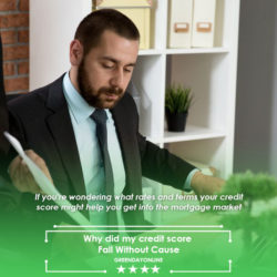 Man wearing black suit working in front of his laptop and papers